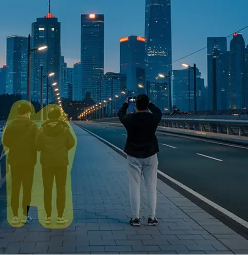 A pixelated image of an orange and white cat lying down, looking to the side, with blurred greenery in the background